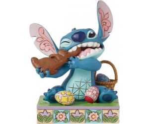 Figura enesco diseny stitch comiendo conejo de chocolate con huevos