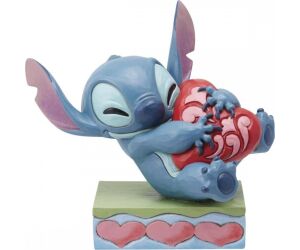 Figura enesco disney stitch abrazando un corazón