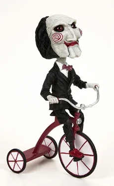 Figura neca saw head knocker puppet on tricyclesue)